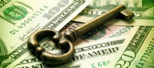 A key and money to protect your wealth